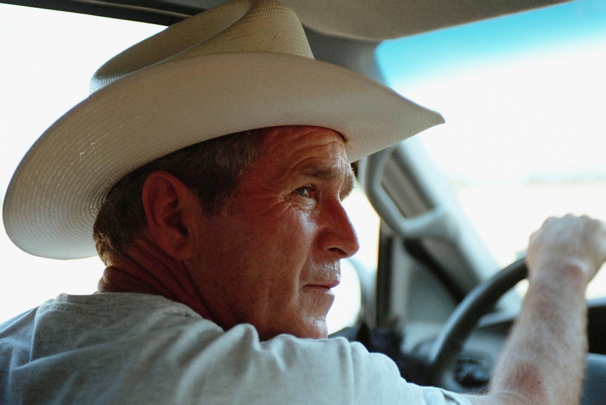 With Barney on his lap, President George W. Bush takes Secretary of Housing and Urban Development Mel Martinez and his wife, Kitty, on a driving tour of Prairie Chapel Ranch Wednesday, Aug. 7, 2001, in Crawford, Texas.   Photo by Eric Draper, Courtesy of the George W. Bush Presidential Library and Museum