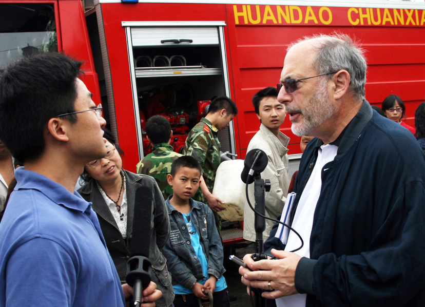 All Things Considered host Robert Siegel reporting after the Sichuan earthquake in China. Credit: NPR