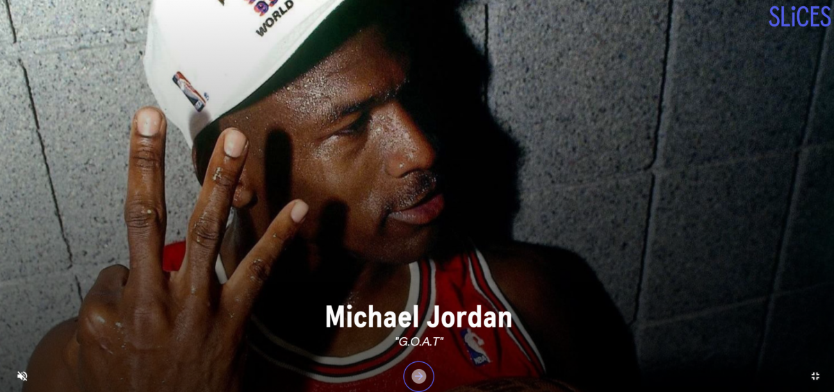 Image of Michael Jordan holding up three fingers with his name written in a white sans serif font in front of him with his nickname "G.O.A.T." written underneath it.