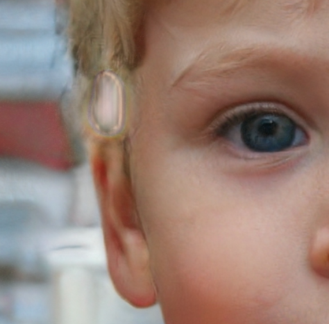 Example of an AI generated image: a closeup of the blue eye and the ear of a blond individual — the background has a weird glitch that indicates it is not a real photograph.
