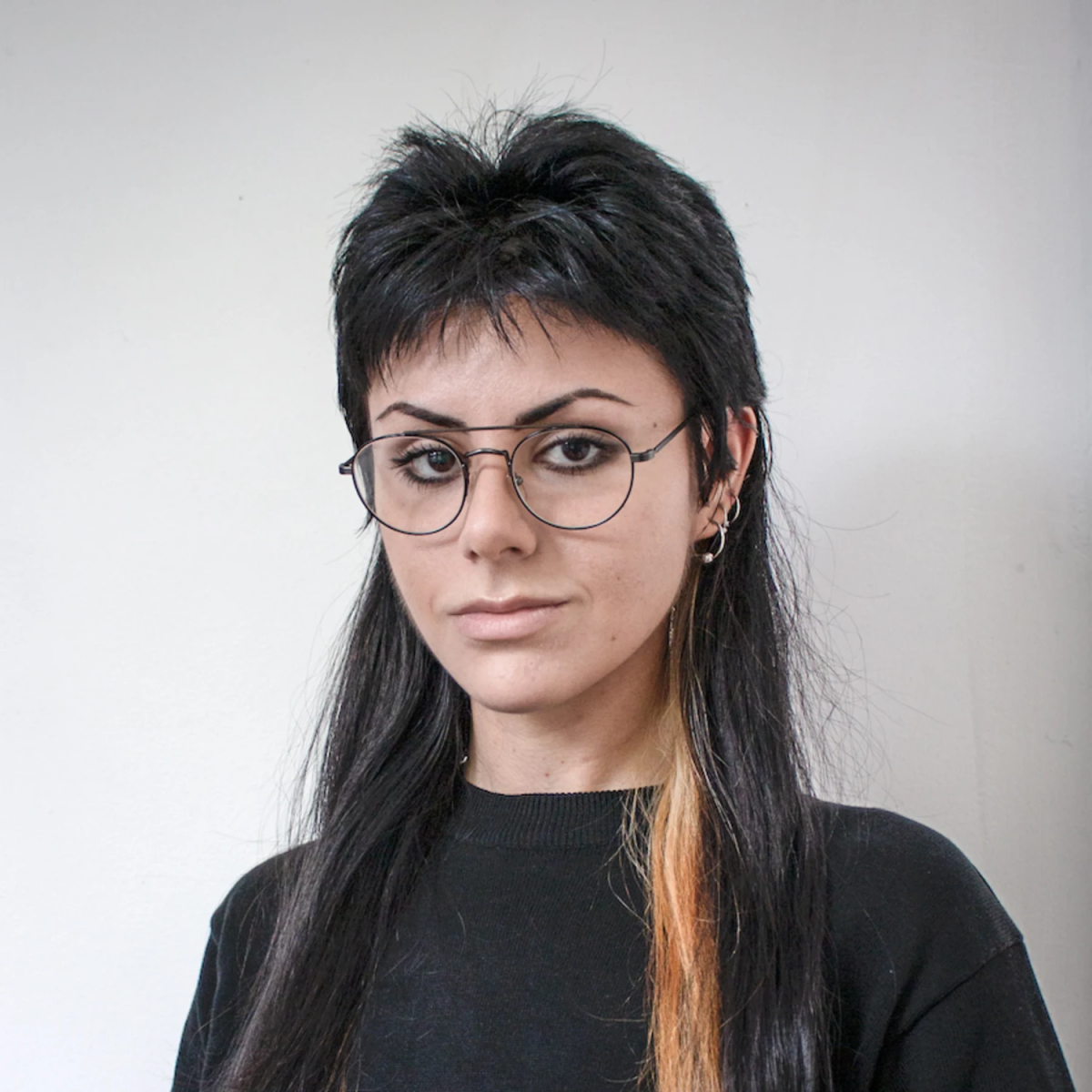 Image of Taraneh Azar. They have black hair and glasses.