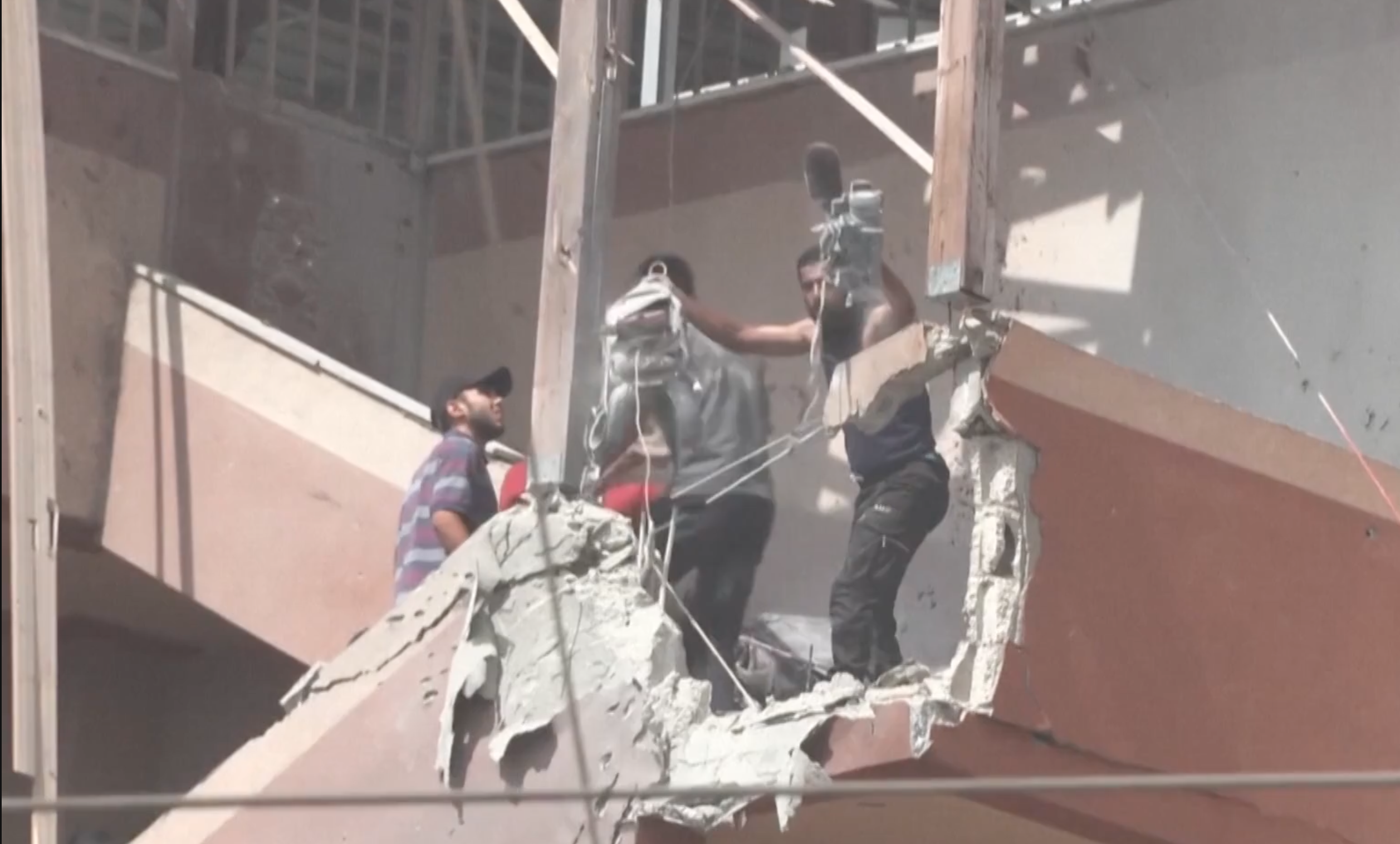 Journalists are seen at Nasser Hospital in Gaza, after an Israeli missile hit and moments before a second Israeli projectile landed killing them in this scene from The New York Times' visual investigation of the attack.