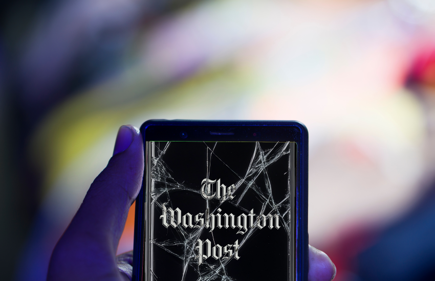 Photo shows Washington Post app on a phone with a cracked screen.