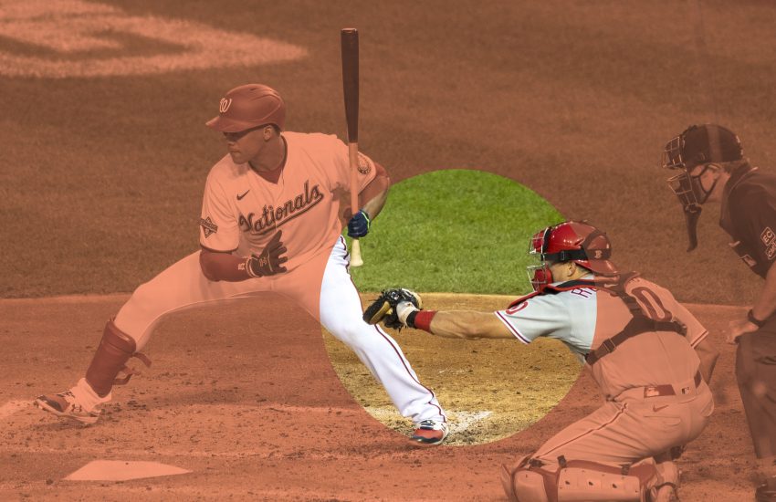 Baseball catcher crouching behind a hitter