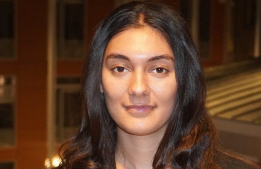 Image shows woman with long dark hair