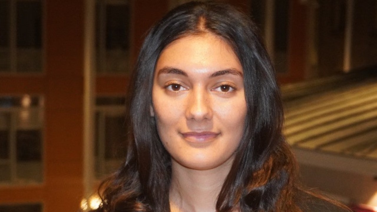 Image shows woman with long dark hair